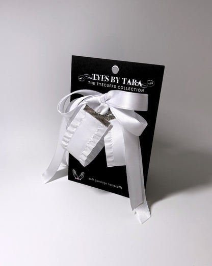 White Ruffled Bow Handcuffs on the Black Card