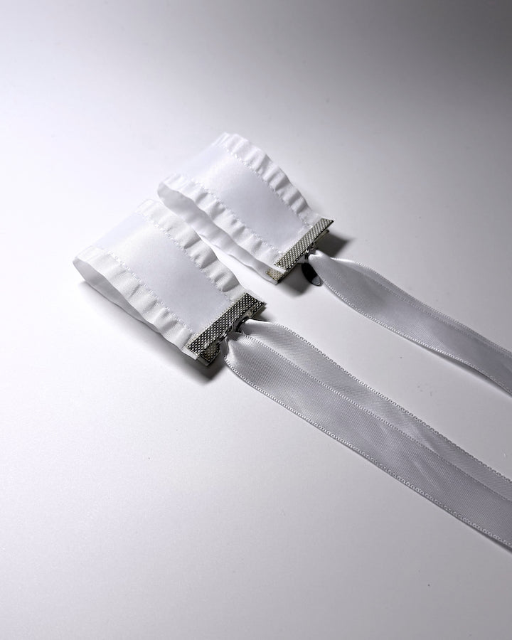 Maiden White Ruffled Bow Handcuffs showing the ruffles