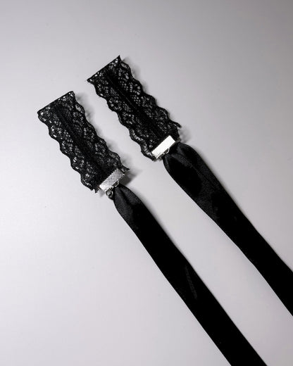 Siren Black Lace Handcuffs showing cuffs folded with long satin ties