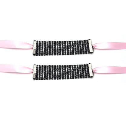 Vixen Black Sparkly Handcuffs Flatlay with Long Pink Satin Ties