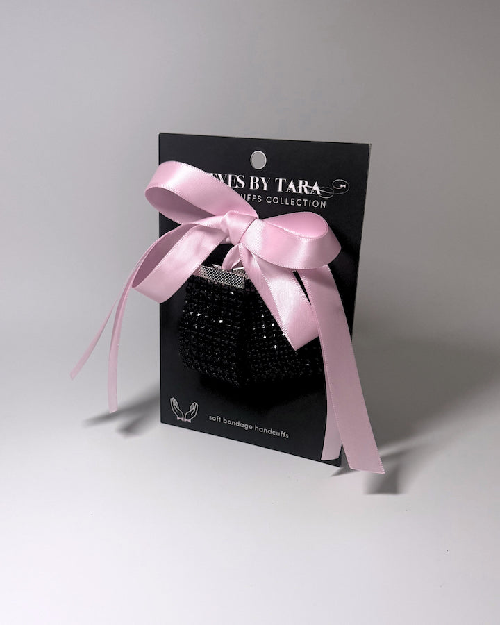 Black Sparkly Soft Bondage Handcuffs displayed on the black card