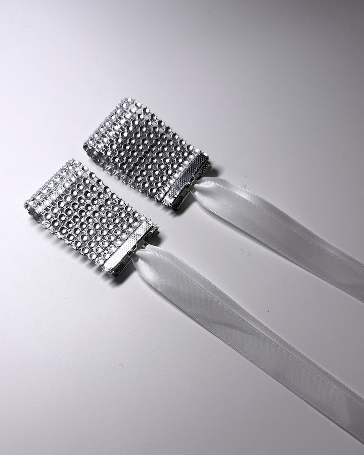Vixen Sparkly White Rhinestone Mesh Handcuffs on light gray background 