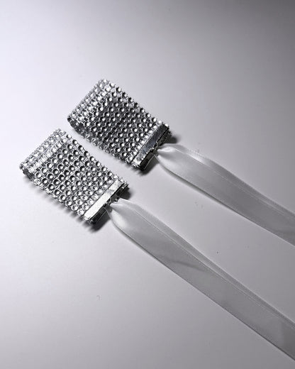 Vixen Sparkly White Rhinestone Mesh Handcuffs on light gray background 
