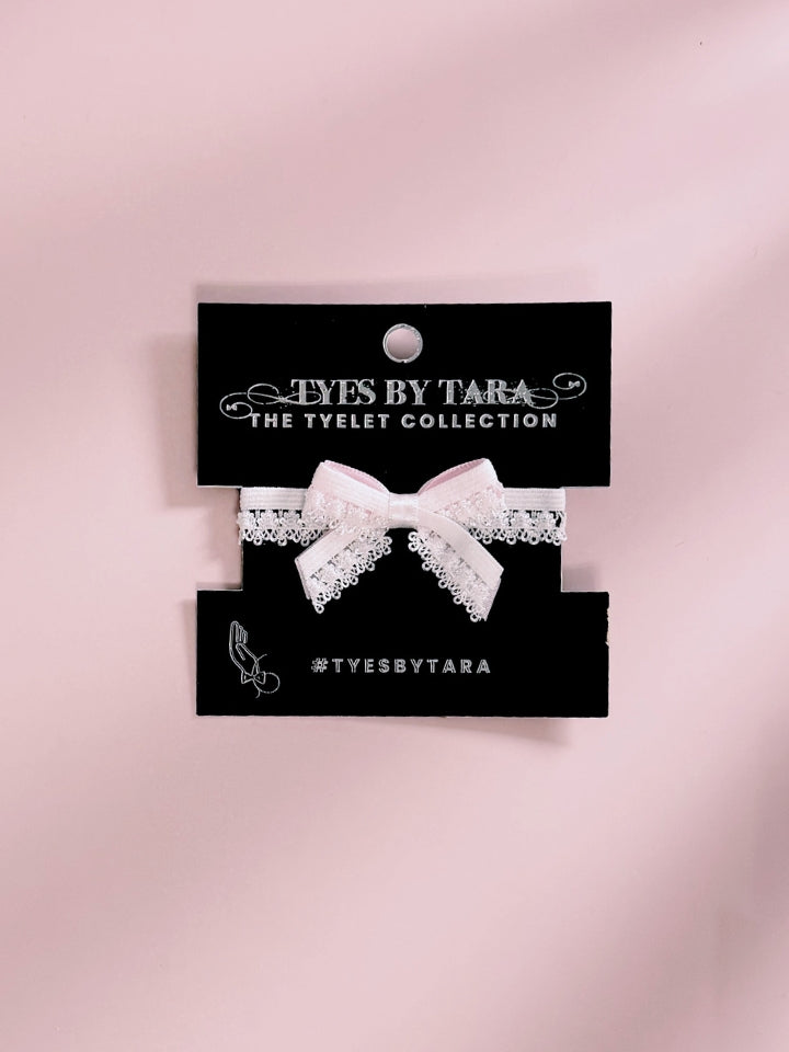 Belle White Bow Bracelet on Black Card