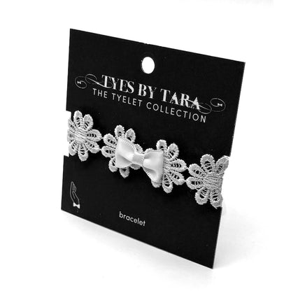 blossom white flower bow bracelet on black card