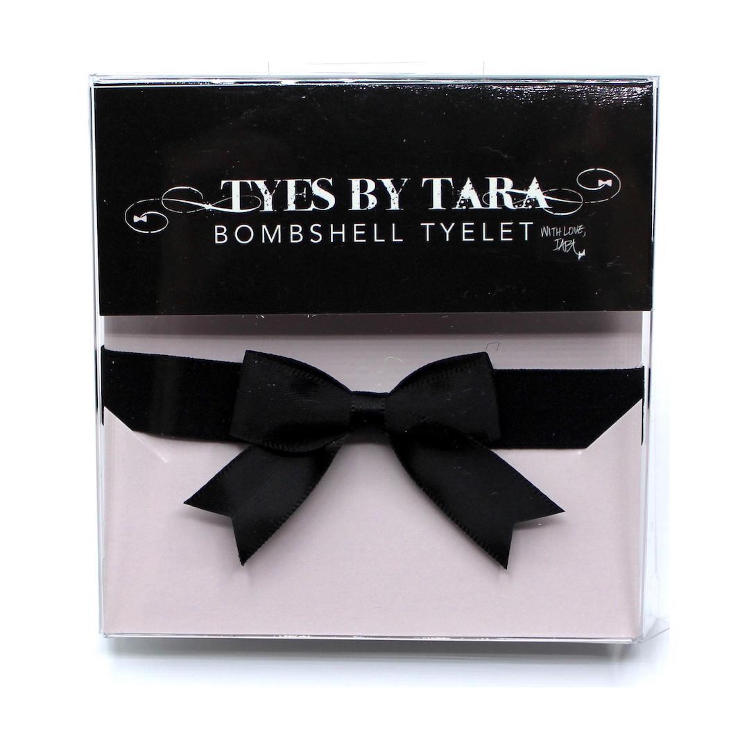 Black Bow Bracelet with Dovetail Accents and Elastic Wristband Packaging View