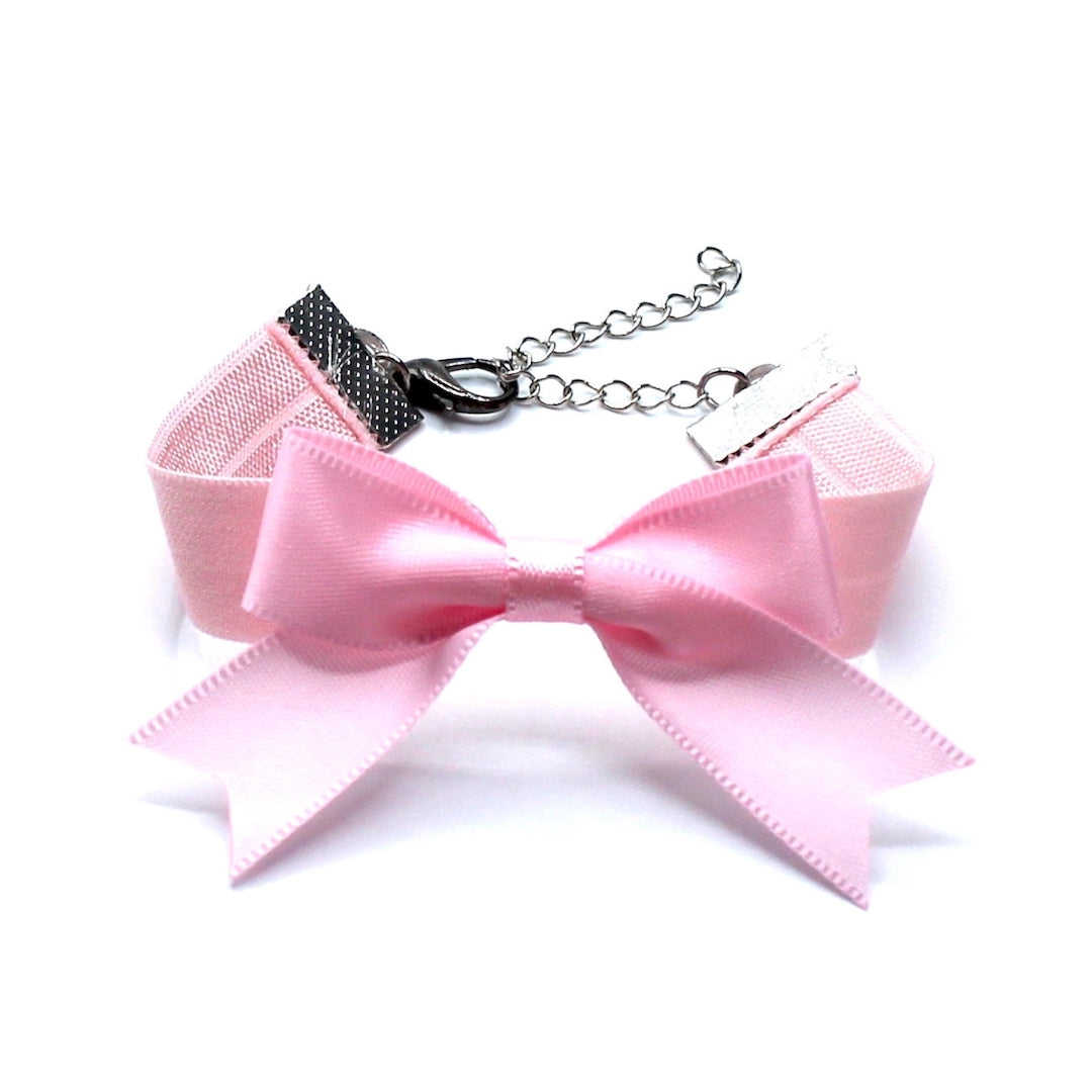 Pink Bow Bracelet with Dovetail Accents and a Pink Elastic Wristband