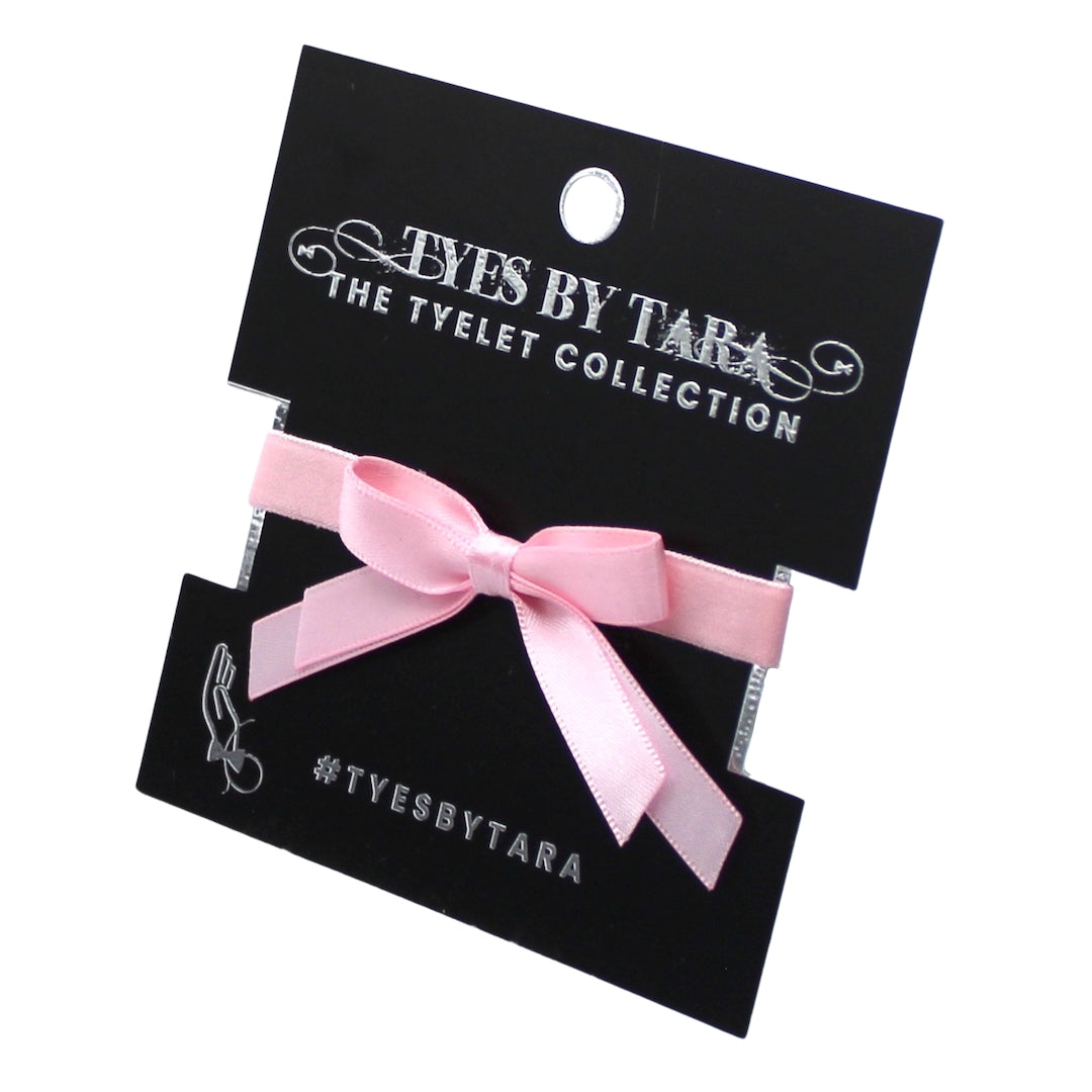 Pink Doll Bow Bracelet on black card