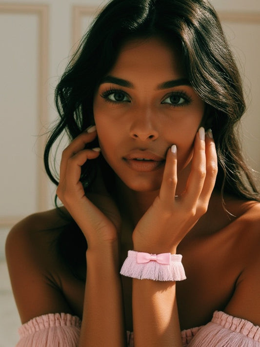 Beautiful dark skinned model in pink fringe bracelet 