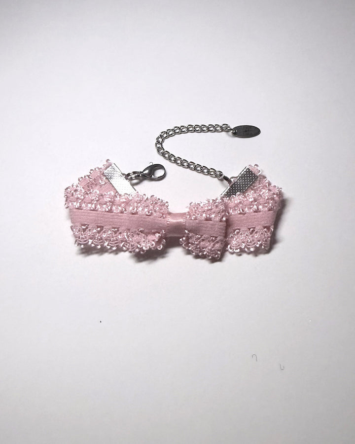 Pink Bracelet with Bow with extender chain and lobster clasp on gray background