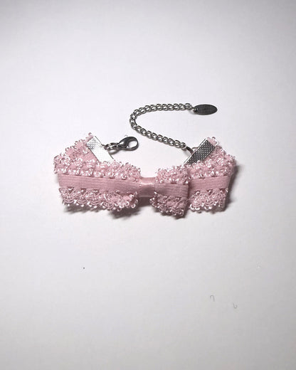 Pink Bracelet with Bow with extender chain and lobster clasp on gray background
