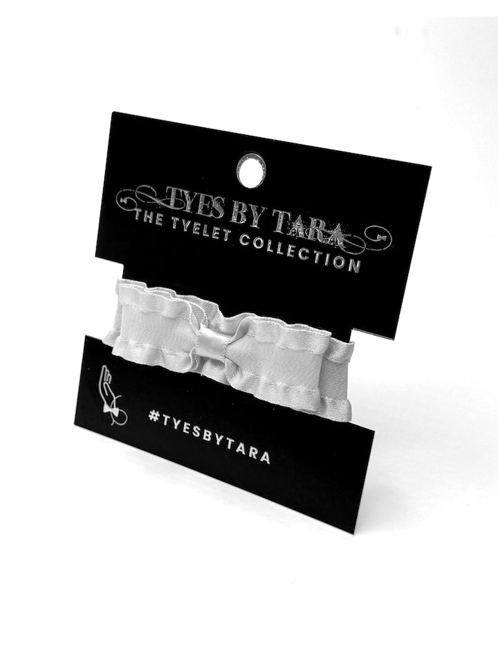 White Ruffled Bow Bracelet on Black Card