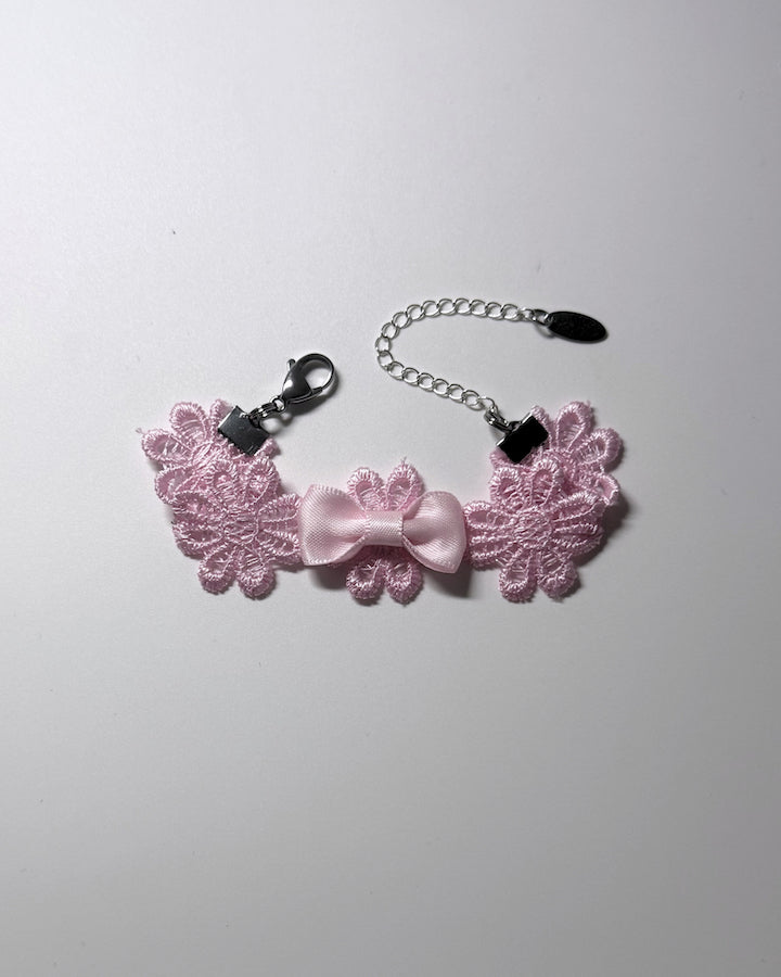 Pink Flower Bow Bracelet on softly lit background