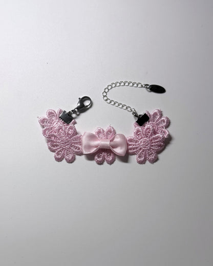 Pink Flower Bow Bracelet on softly lit background