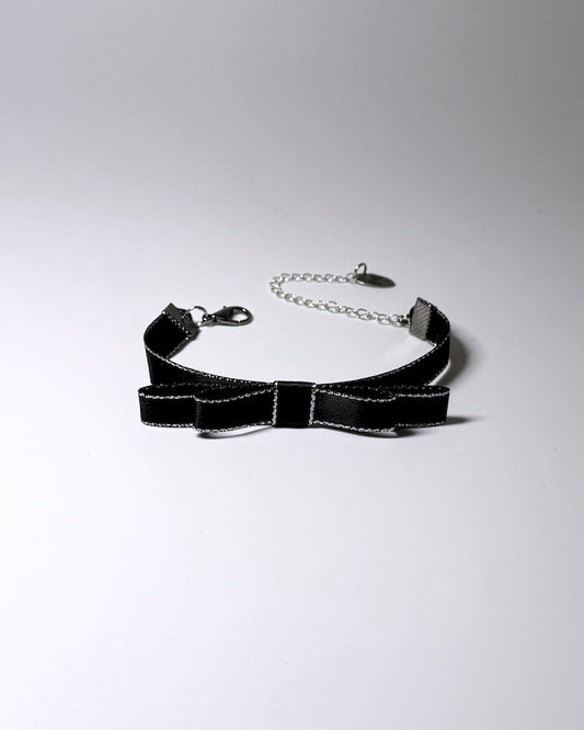 queen black metallic trimmed bracelet with bow