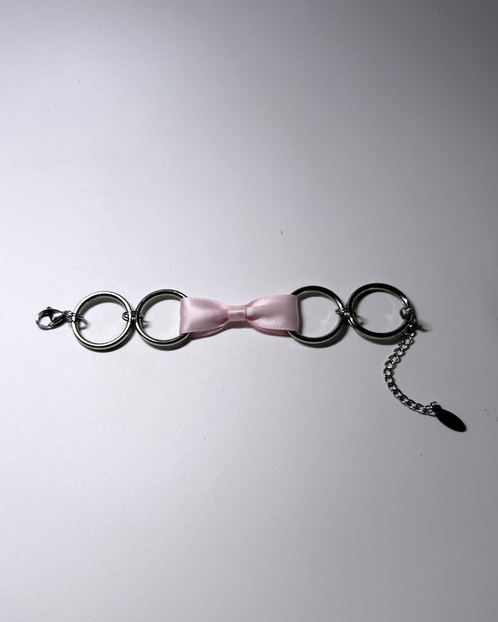 Runaway Pink Bow Bracelet with Stainless Steel O Rings Flatlay