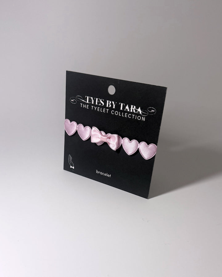 Sweetheart Pink Heart Bow Bracelet on Black Card