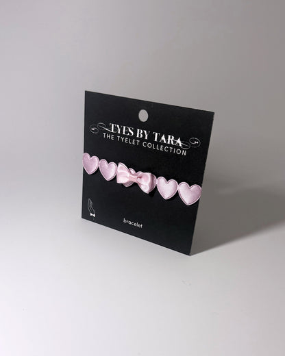 Sweetheart Pink Heart Bow Bracelet on Black Card