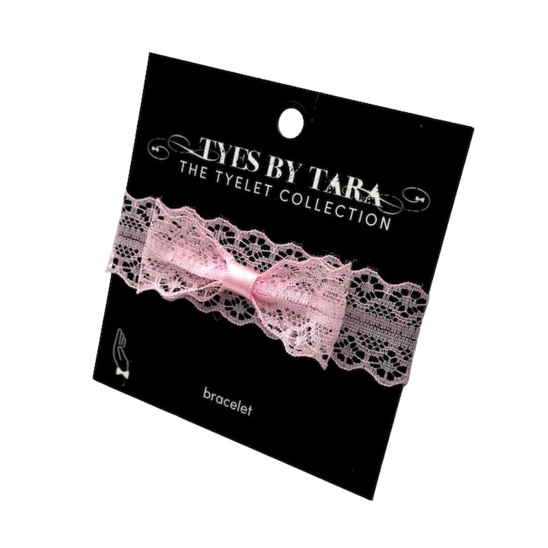 siren pink lace bow bracelet on black card