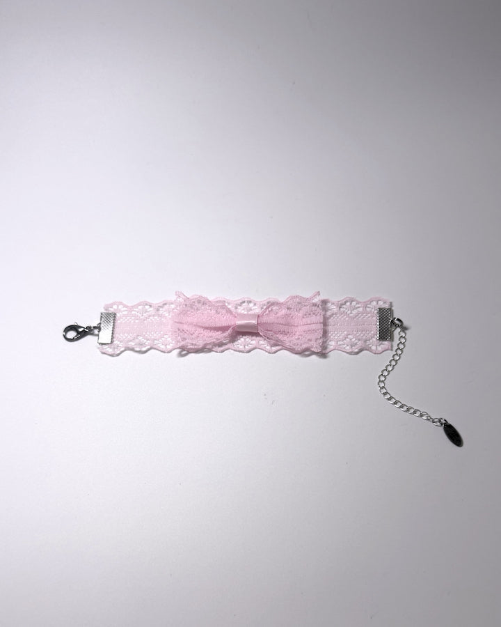 Siren Pink Bow Lace Bracelet on light gray background