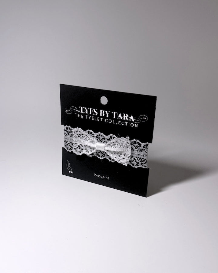White Lace Bow Bracelet on Black Retail Card