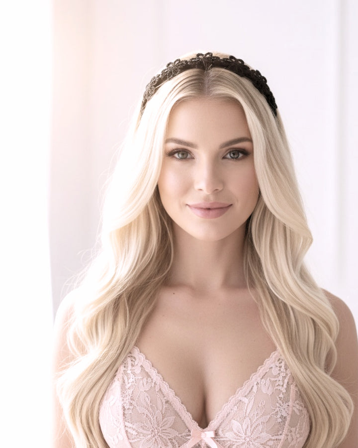 Blonde model in light pink lingerie wearing the Blossom Black Flower Bow headband