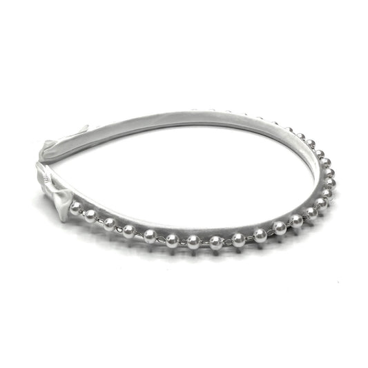 pearl white headband on white background side view