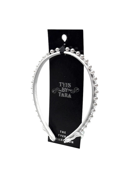 white pearl headband on black card