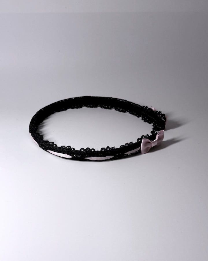 Side View of Black Lace Headband with Pink Bows 