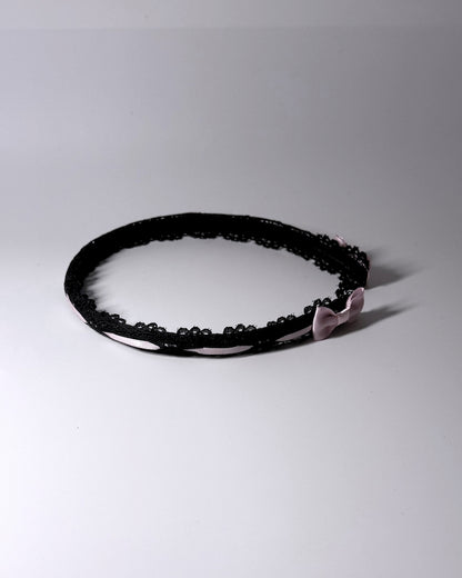 Side View of Black Lace Headband with Pink Bows 