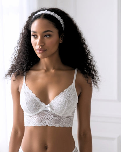 Model in Chantilly White Lace Headband in an elegant white room with pretty sunshine