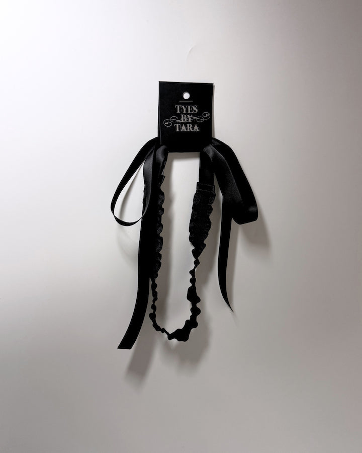 Black Ruffled Headband with Long Black Satin Ties on black card