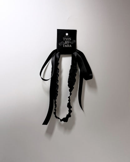 Black Ruffled Headband with Long Black Satin Ties on black card