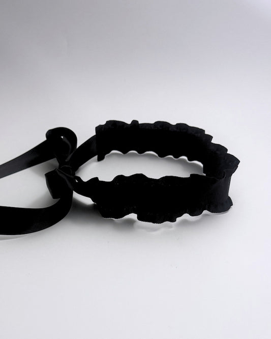 Black ruffled headband hair accessory side view