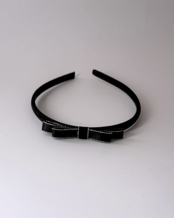 Black Bow Headband with black bow on top of crown top view