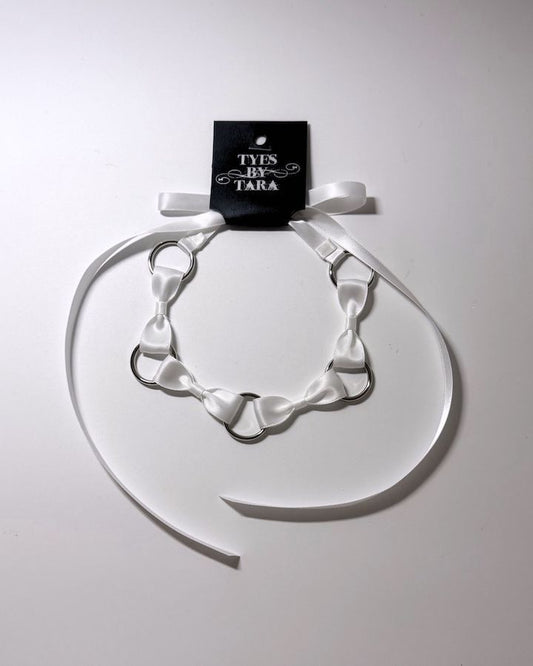 White Bow Headband with Silver O Rings and retail tag attached