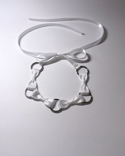 White Bow Headband with Silver O Rings showing long satin ties 