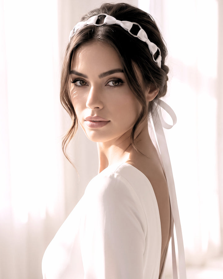 Beautiful Model in Runaway Pink Bow Headband with long satin ties in wedding dress
