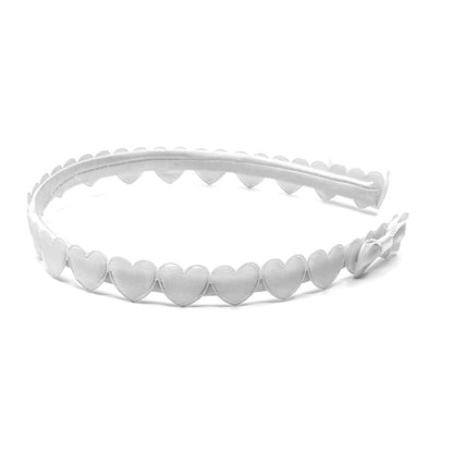 white heart bow headband on white background side view