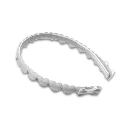 white heart bow headband on white background