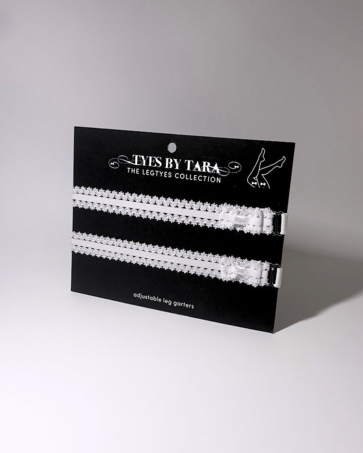 Lady White Bow Leg Garters on Black Card