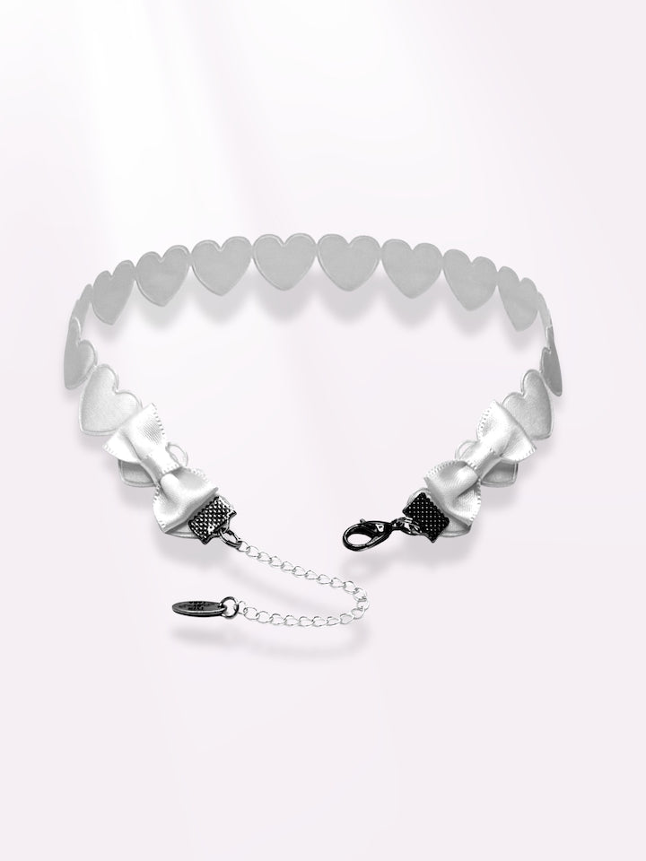white heart bow choker on light pink background