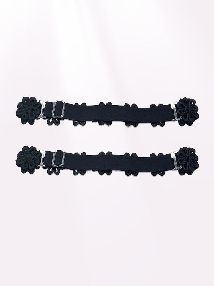 back view of black flower bow leg garters 