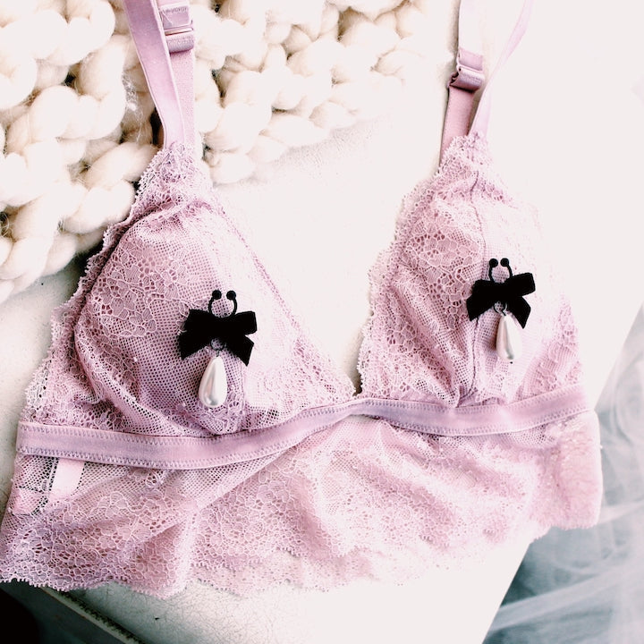 Black Velvet Bow Nipple Clamps on Pink Bra