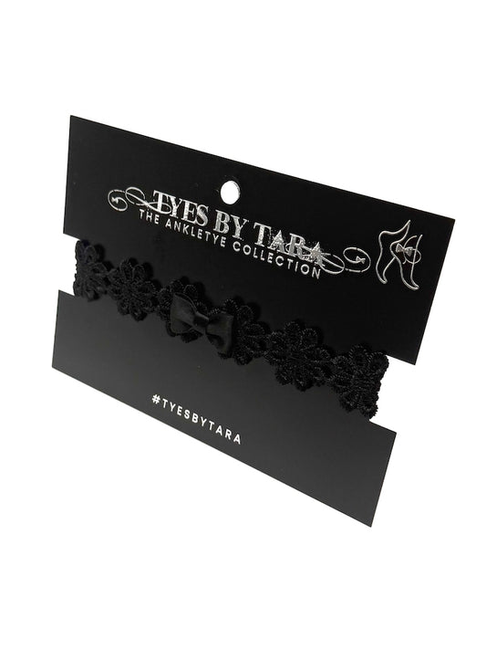 black flower bow anklet on black card