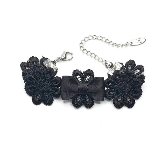 Black Flower Bracelet with Black Bow on White Background 
