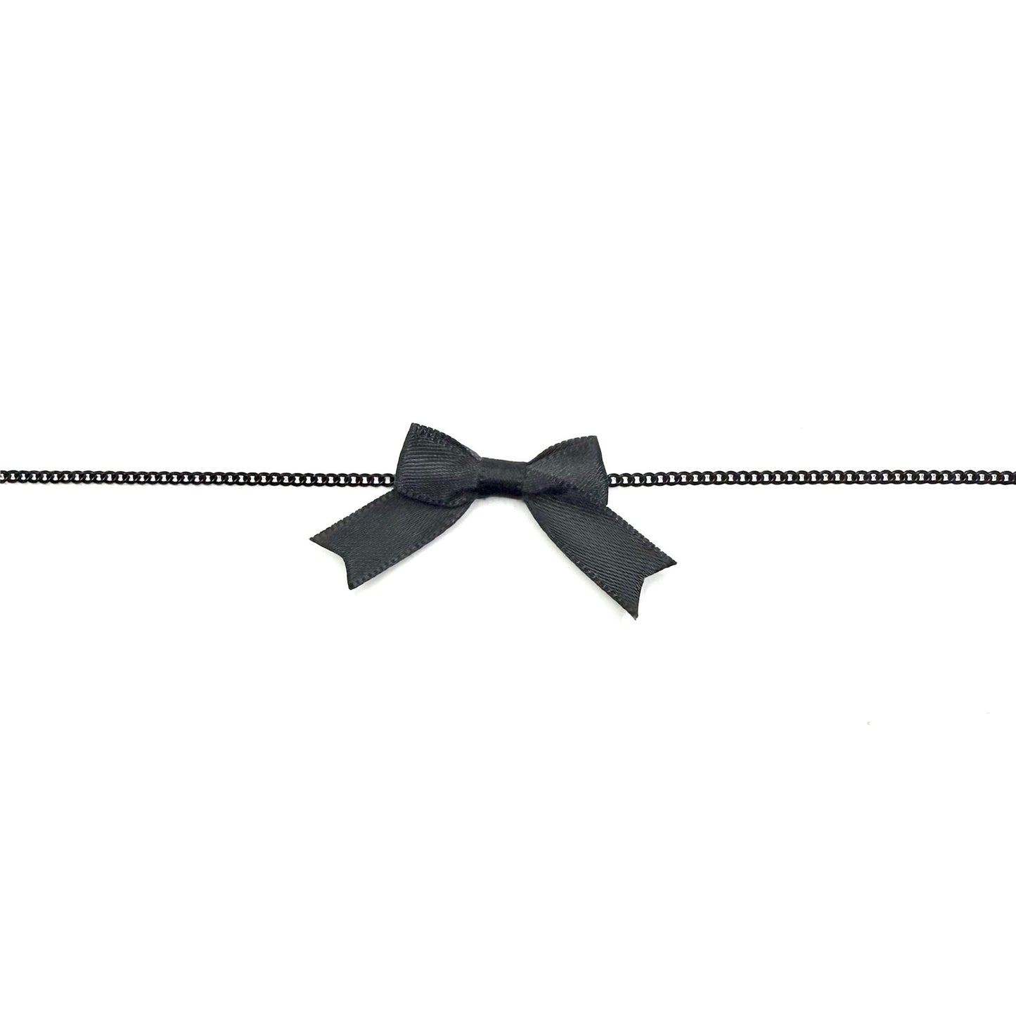 Black bowtie necklace on a white background