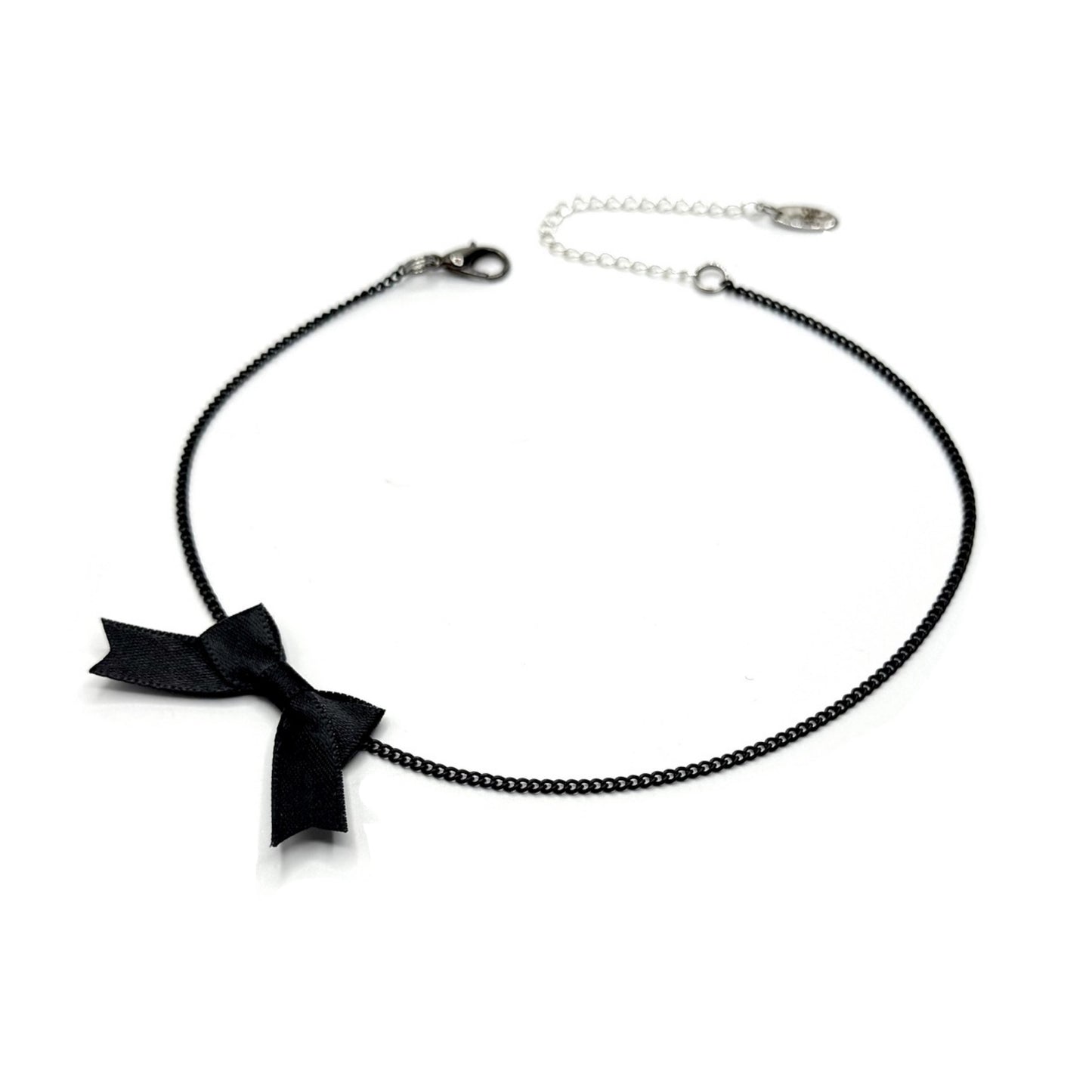 Black bow necklace on a white background
