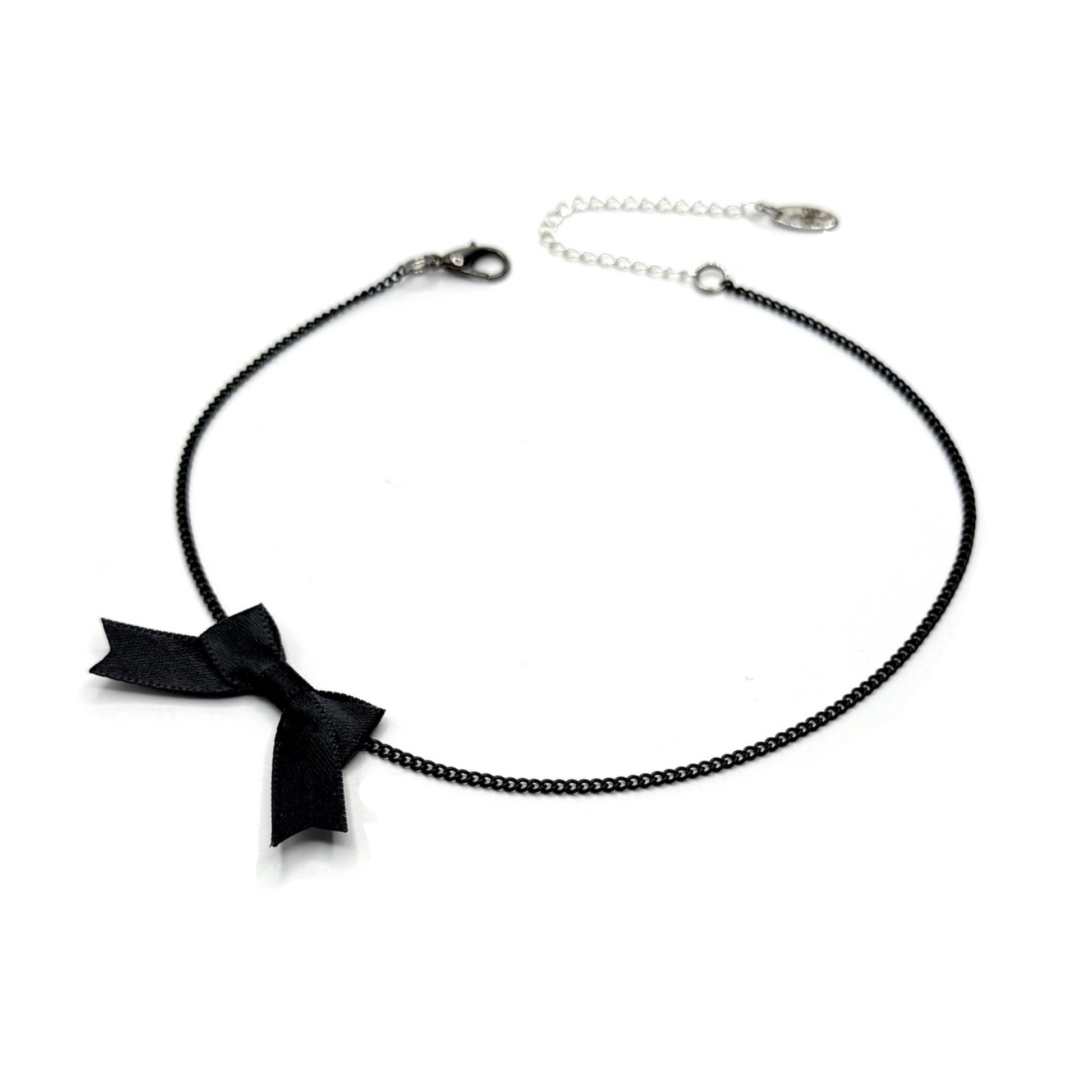 Black bow necklace on a white background