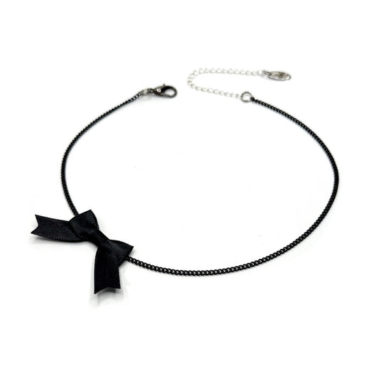 Black bow necklace on a white background